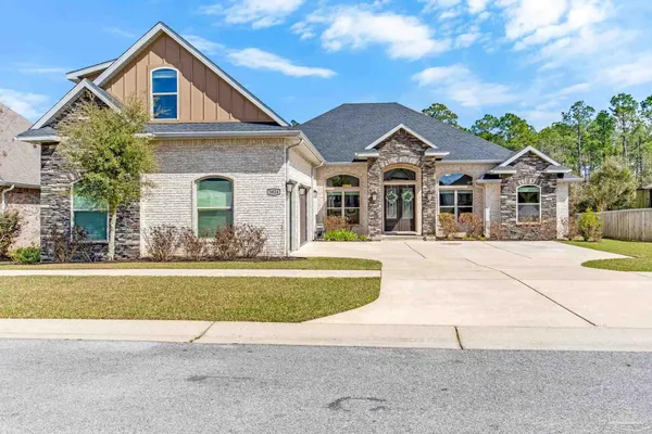 front view of a house with a yard