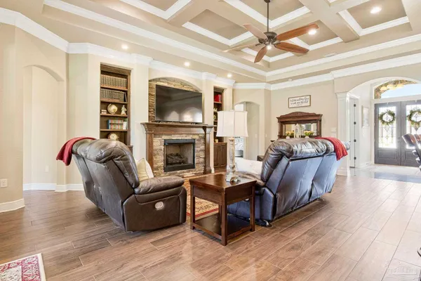 a kitchen with granite countertop cabinets stainless steel appliances and a counter space