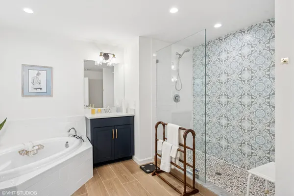 a bathroom with a double vanity sink mirror and