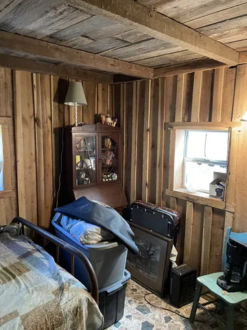 a bedroom with bed and a window