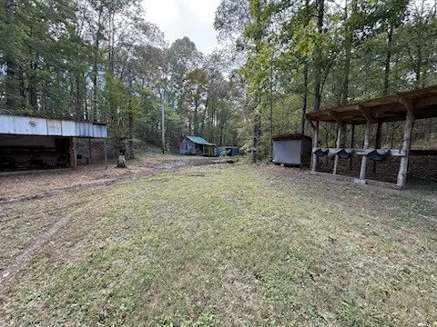 a view of a house with a backyard