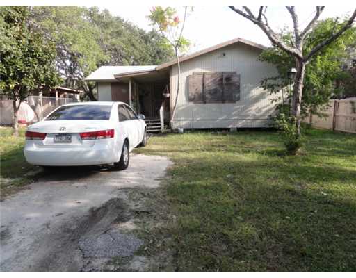 a view of house with backyard space and balcony