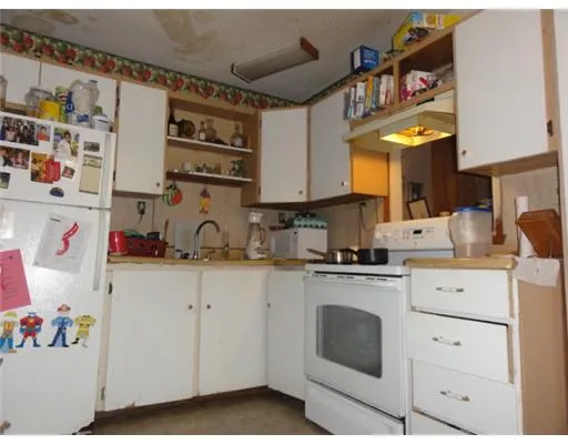 a bedroom with furniture and a flat tv screen