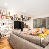 a living room with furniture fireplace and a flat screen tv