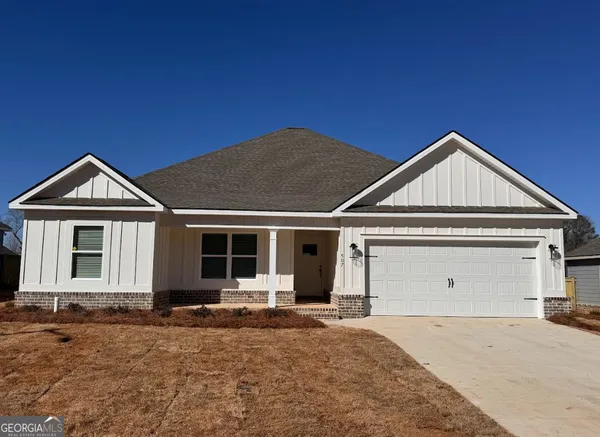 a front view of a house with yard