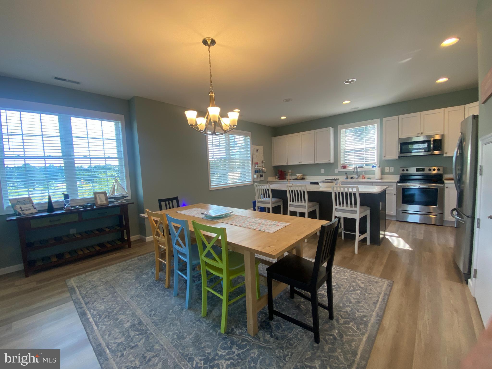 31033 Boatyard Road, Unit 1 Ocean View, DE 19970 - Photo 3 of 24 Large dining area w/cheery windows