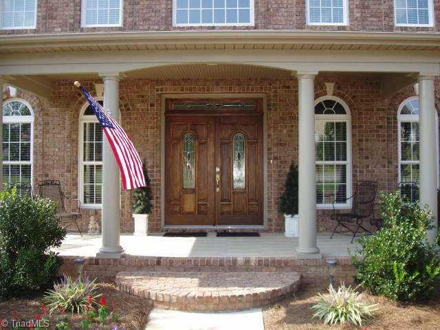 8204 Damson Court Oak Ridge, NC 27310 - Photo 2 of 7 Other. Inviting entrance with solid mahogany doors and transom with leaded glass.