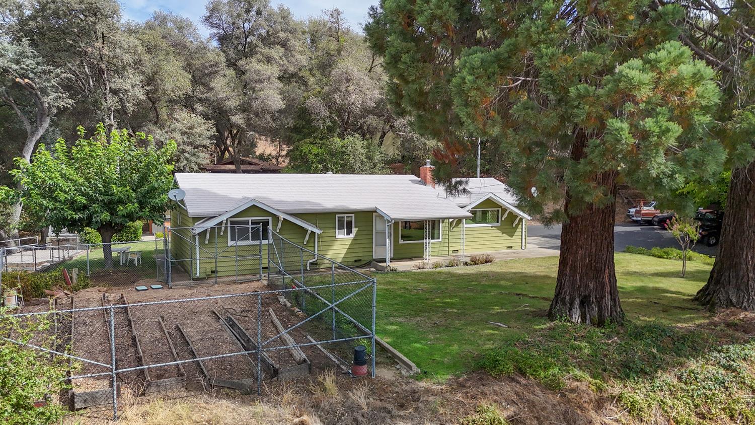 7349 Green Valley Road Placerville, CA 95667 - Photo 7 of 41 Huge, fenced garden area at the front of the home. Pool is to the left.