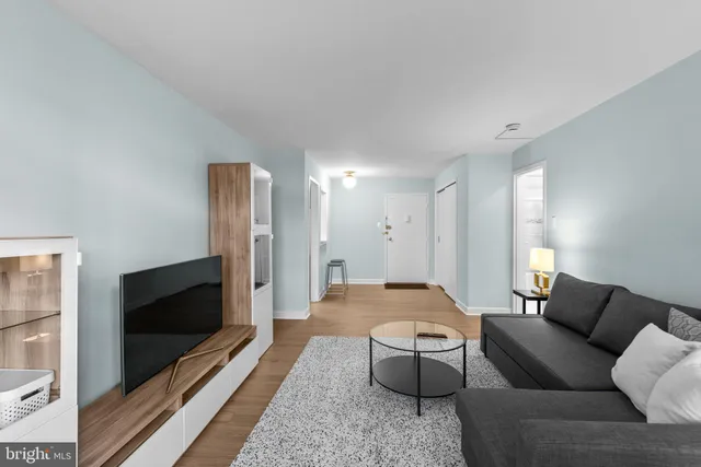 a living room with furniture and a flat screen tv