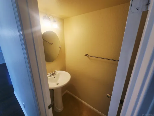 a bathroom with a sink and mirror