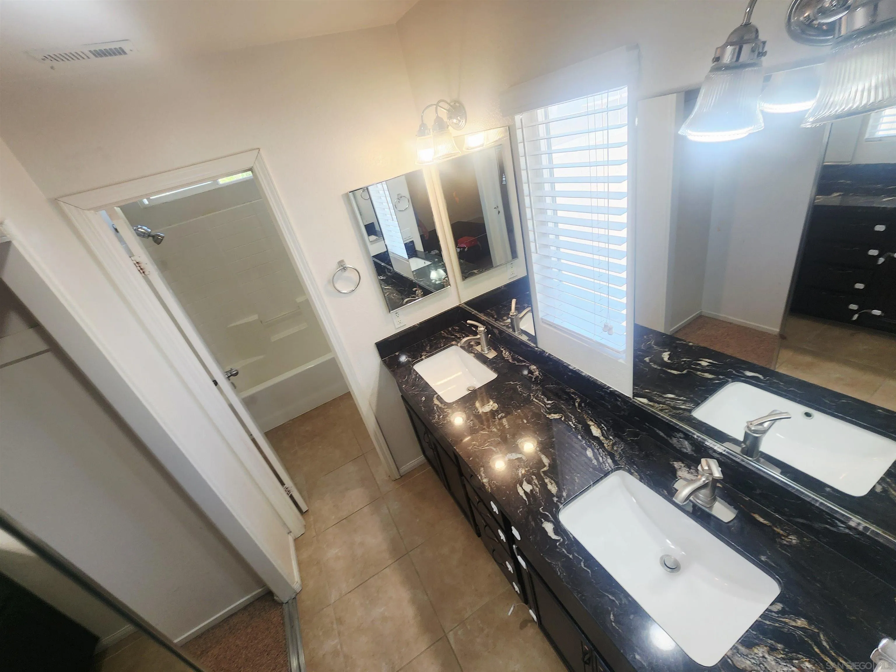 1330 Wendell Cutting Court El Cajon, CA 92021 - Photo 14 of 21 a bathroom with a double vanity sink and mirror