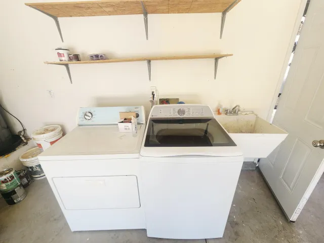 a utility room with dryer and washer