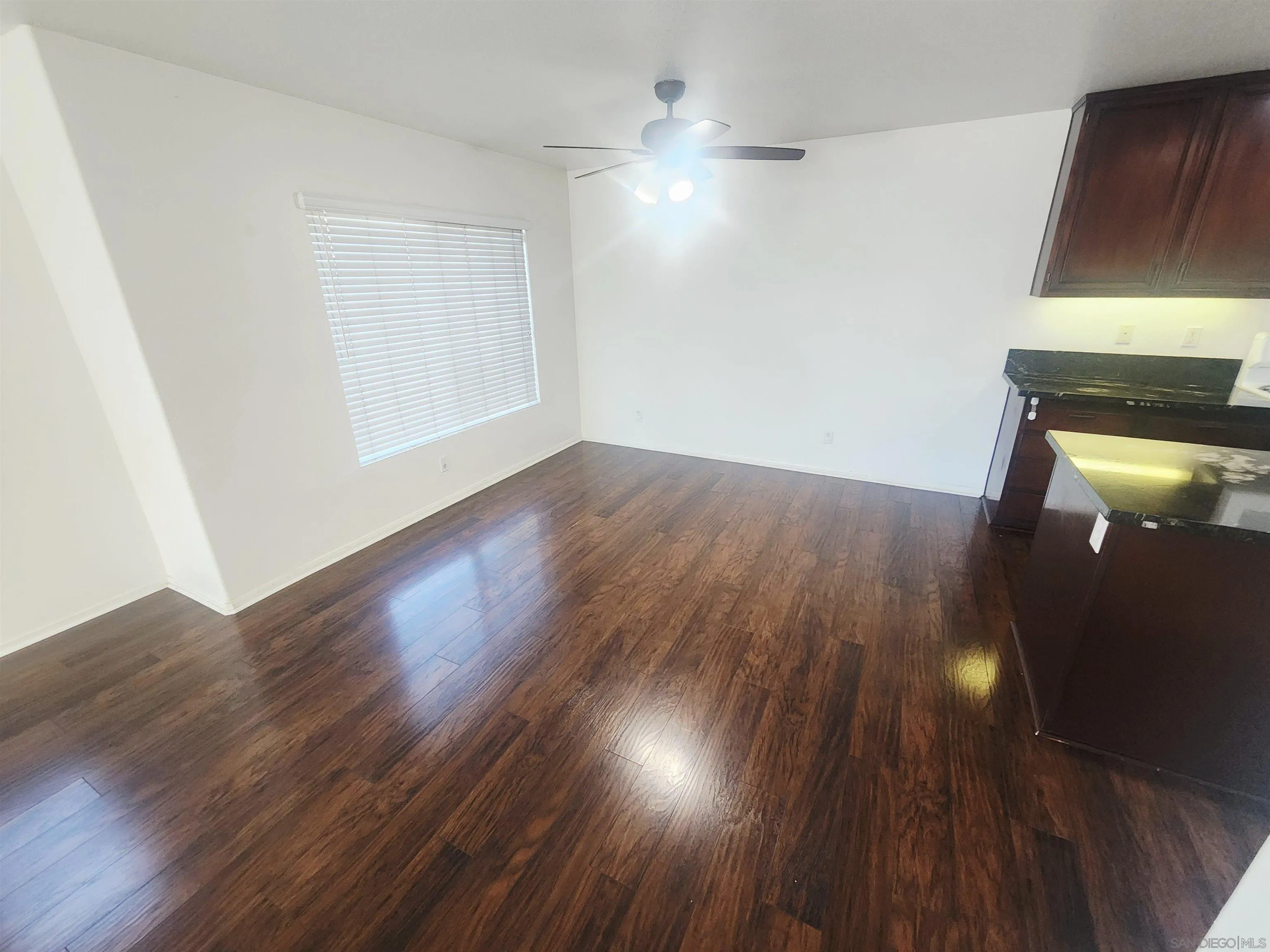 1330 Wendell Cutting Court El Cajon, CA 92021 - Photo 8 of 21 an empty room with wooden floor and windows