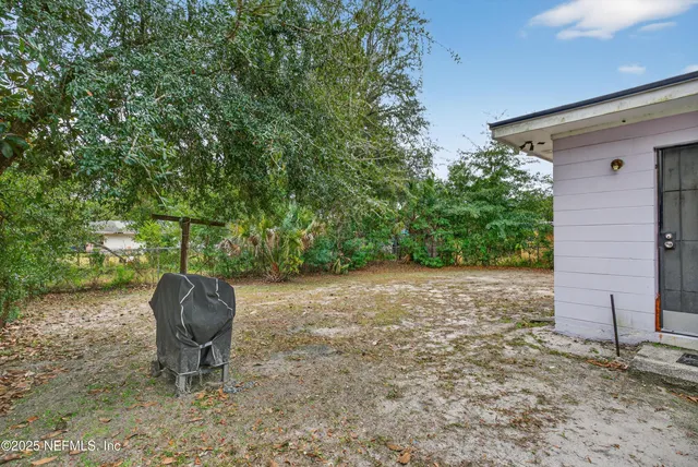 a house that has a tree in front of it