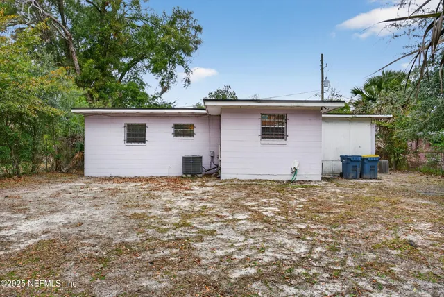 a house view with a backyard space