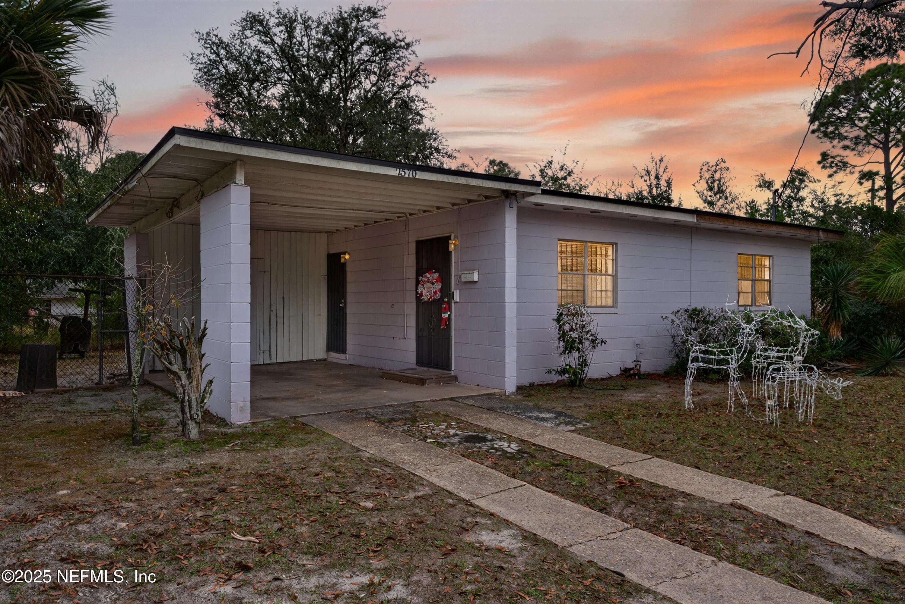 2570 Spirea Street Jacksonville, FL 32209 - Photo 2 of 19 a backyard of a house with yard and barbeque oven