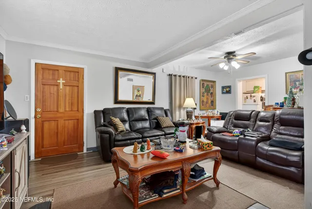a living room with furniture and a flat screen tv