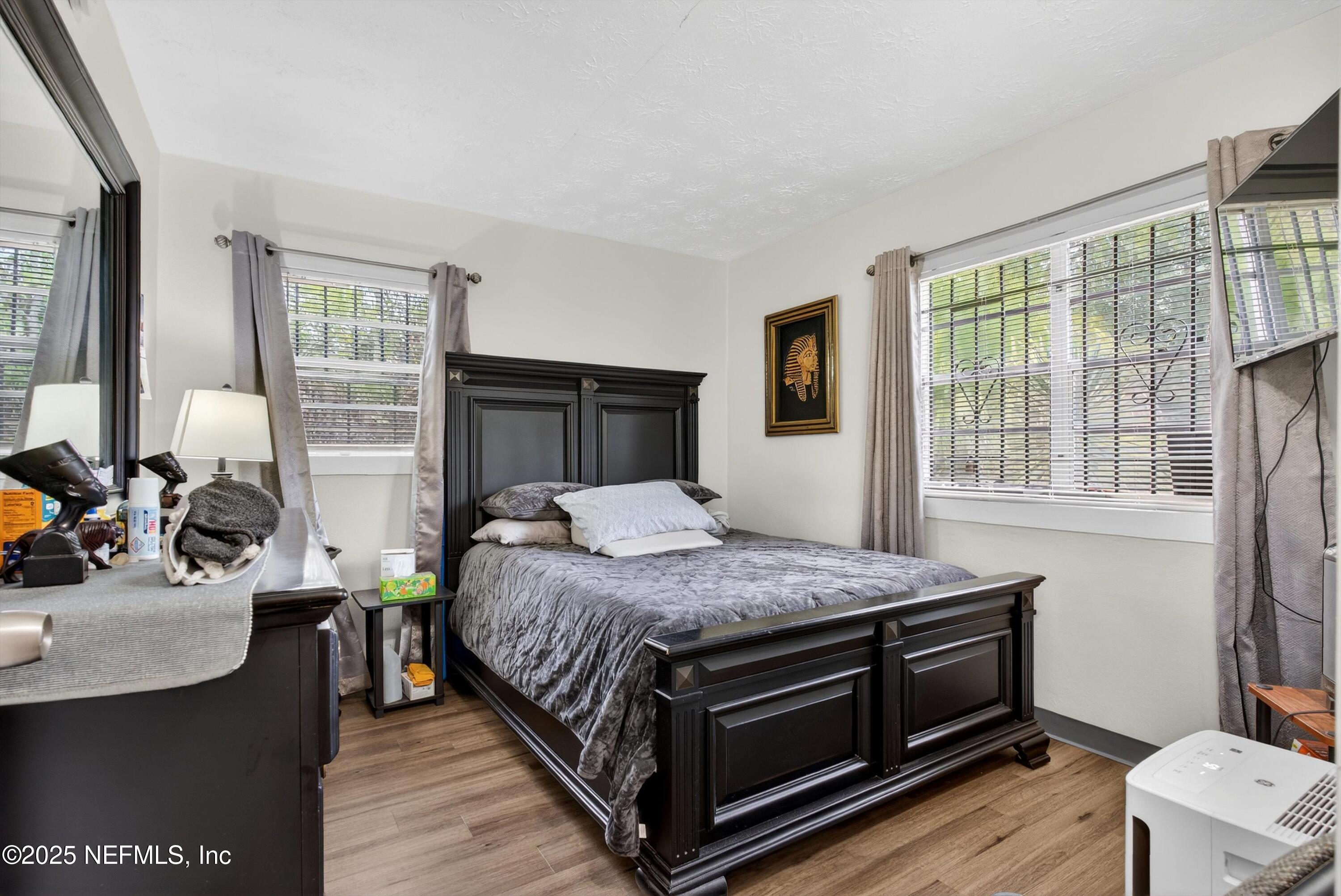 2570 Spirea Street Jacksonville, FL 32209 - Photo 10 of 19 a bed sitting in a bedroom next to a window