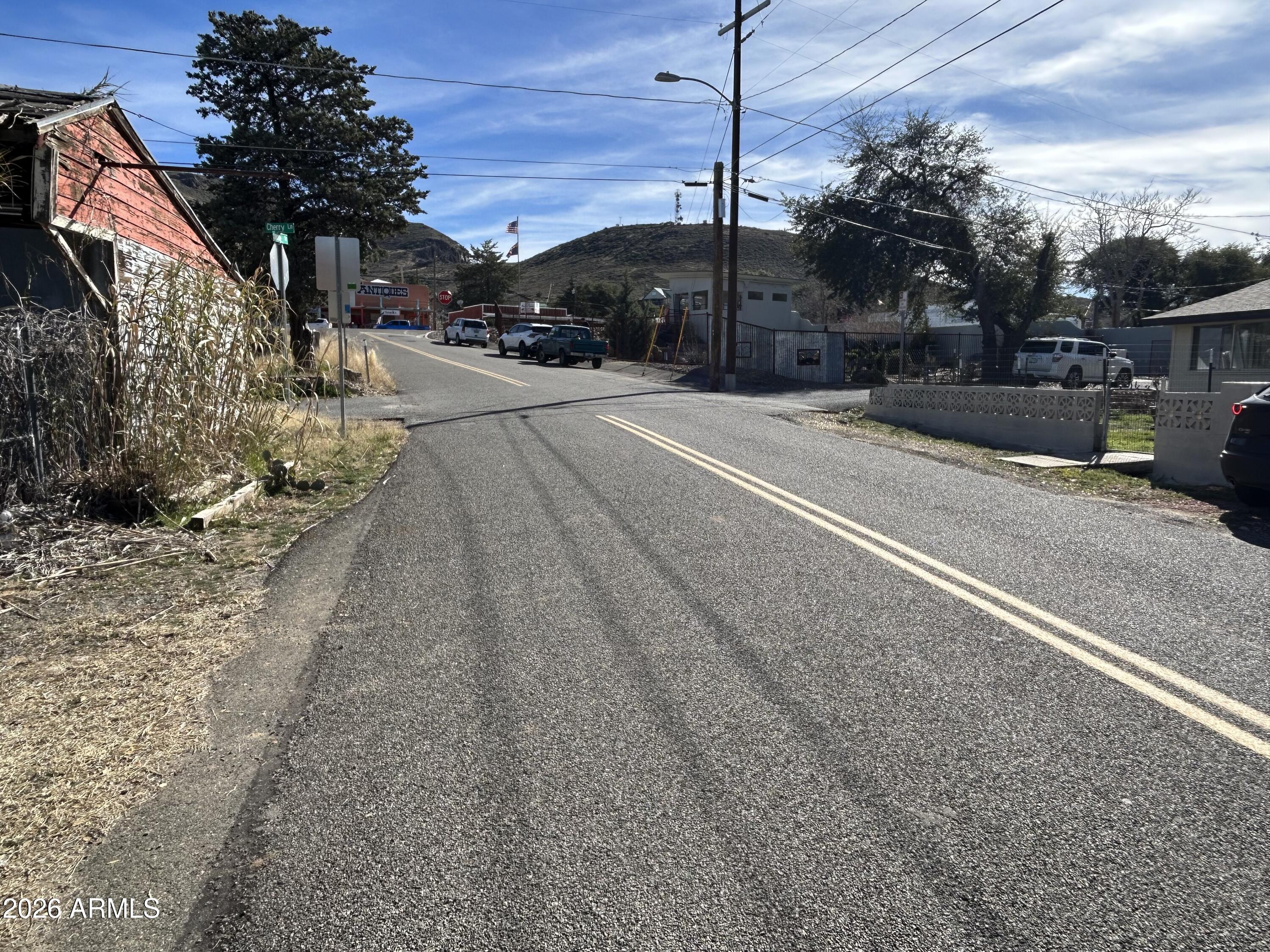 16614 Shrine Drive Yarnell, AZ 85362 - Photo 23 of 40 a backyard of a house with table and chairs plants