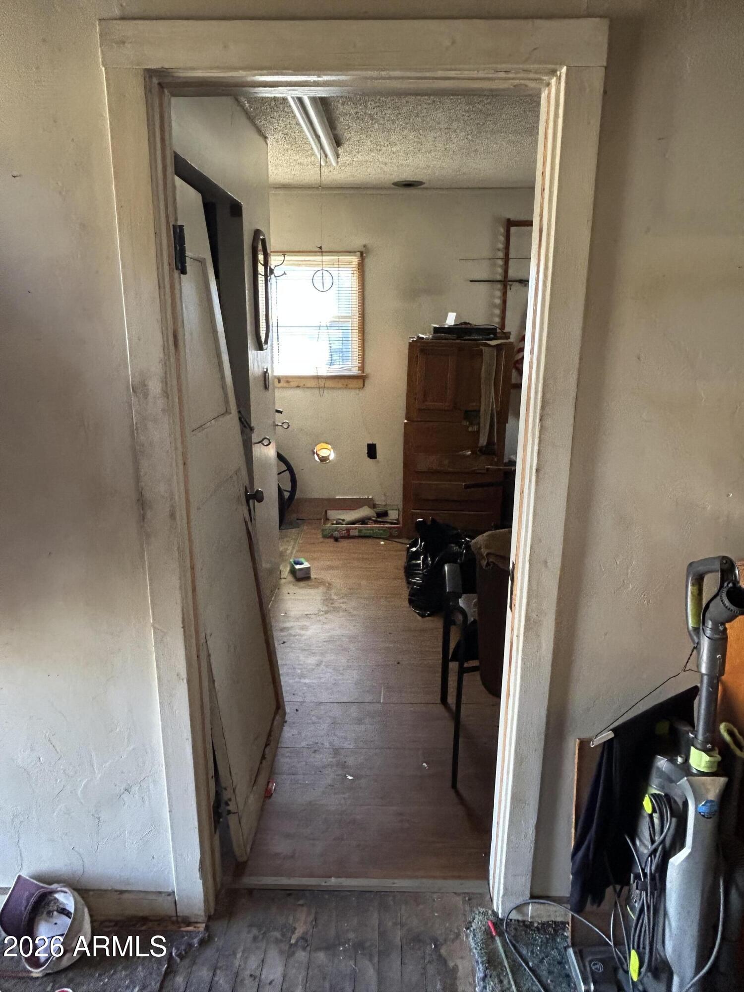 16614 Shrine Drive Yarnell, AZ 85362 - Photo 27 of 36 a view of a hallway with wooden floor and a livingroom view