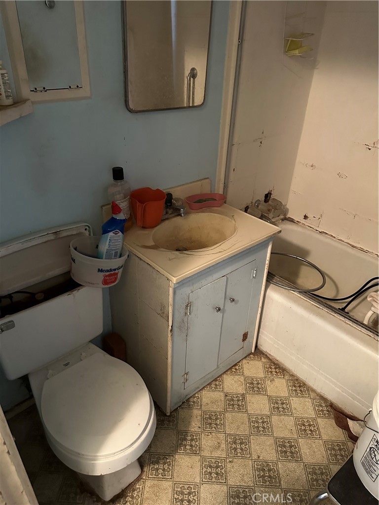 168 Lark Street Oxnard, CA 93033 - Photo 7 of 15 a bathroom with a sink toilet and a mirror