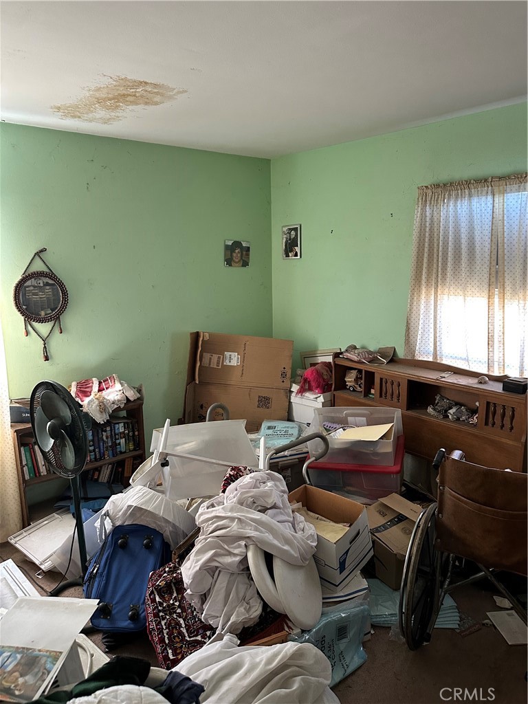 168 Lark Street Oxnard, CA 93033 - Photo 9 of 15 a bedroom with furniture and a fan