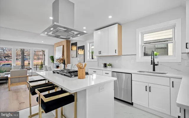 a view of kitchen with sink microwave and cabinets