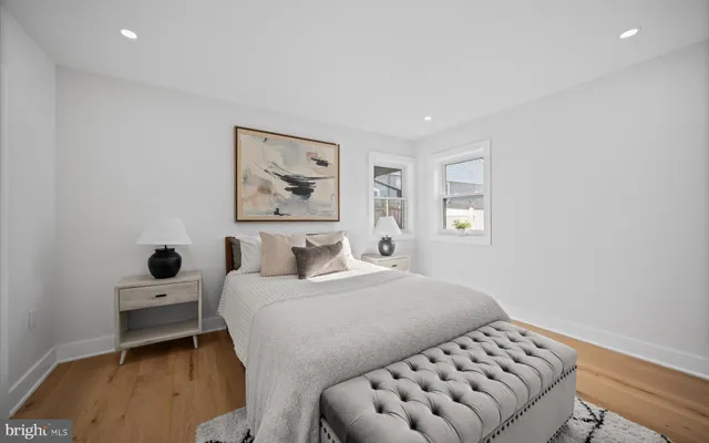 a bedroom with a bed and a couch