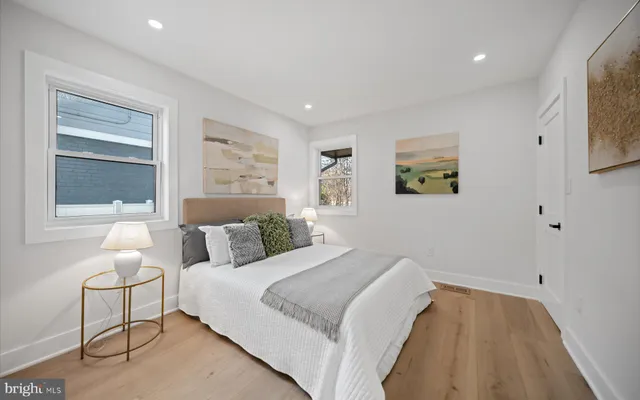 a bedroom with bed and window