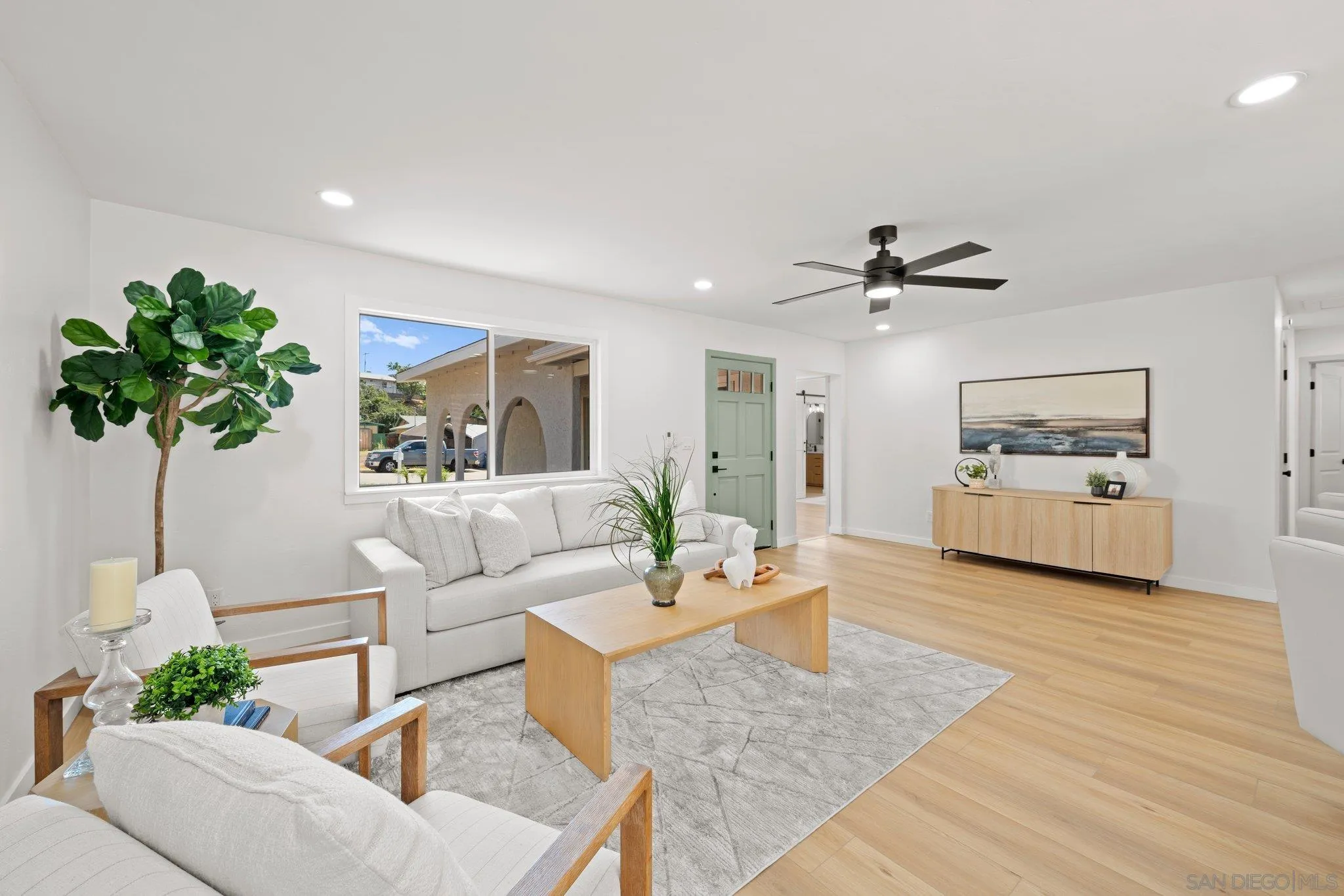 9117 Heatherdale Street Santee, CA 92071 - Photo 11 of 31 a living room with furniture and a potted plant