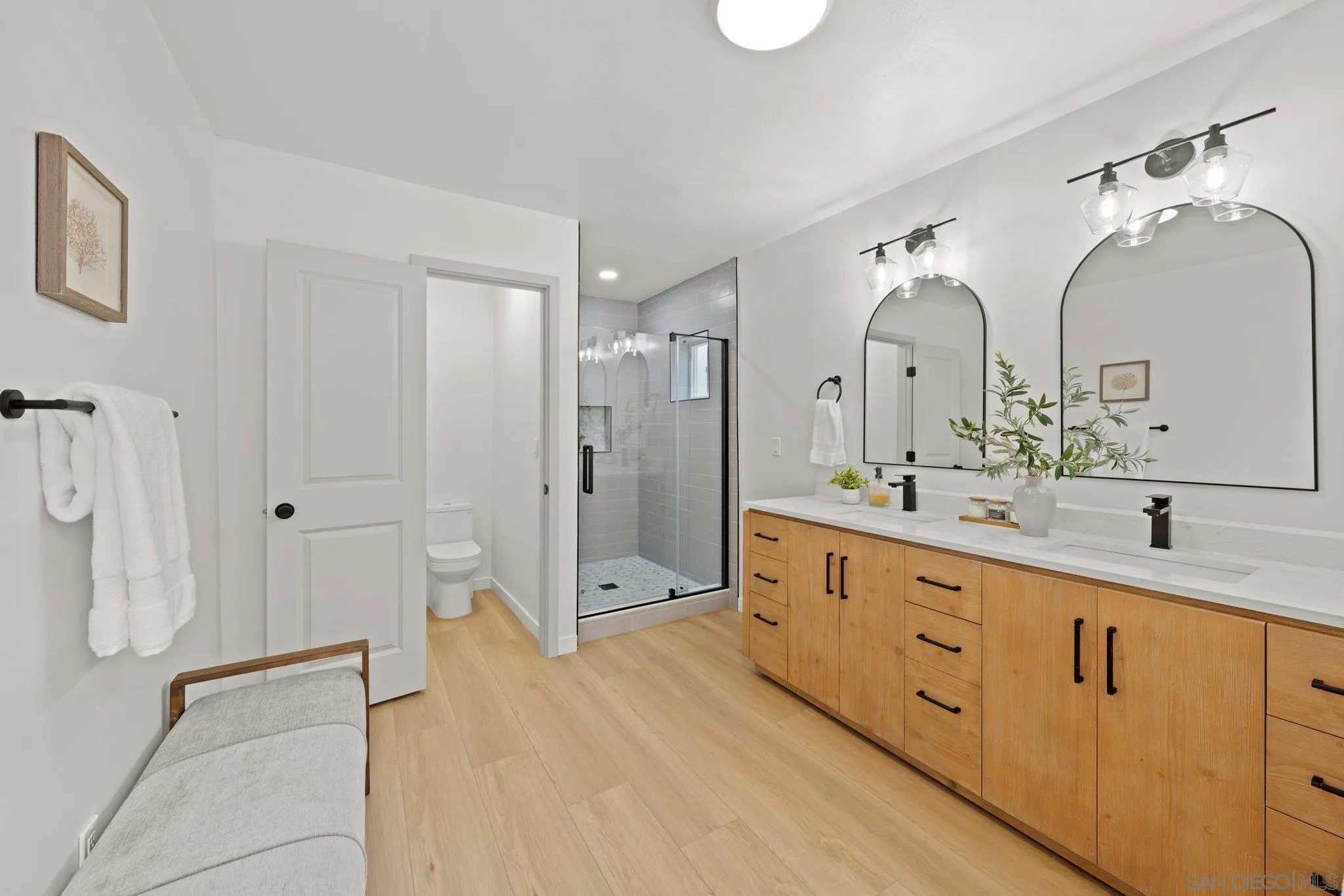 9117 Heatherdale Street Santee, CA 92071 - Photo 16 of 31 a bathroom with double vanity sink and a mirror