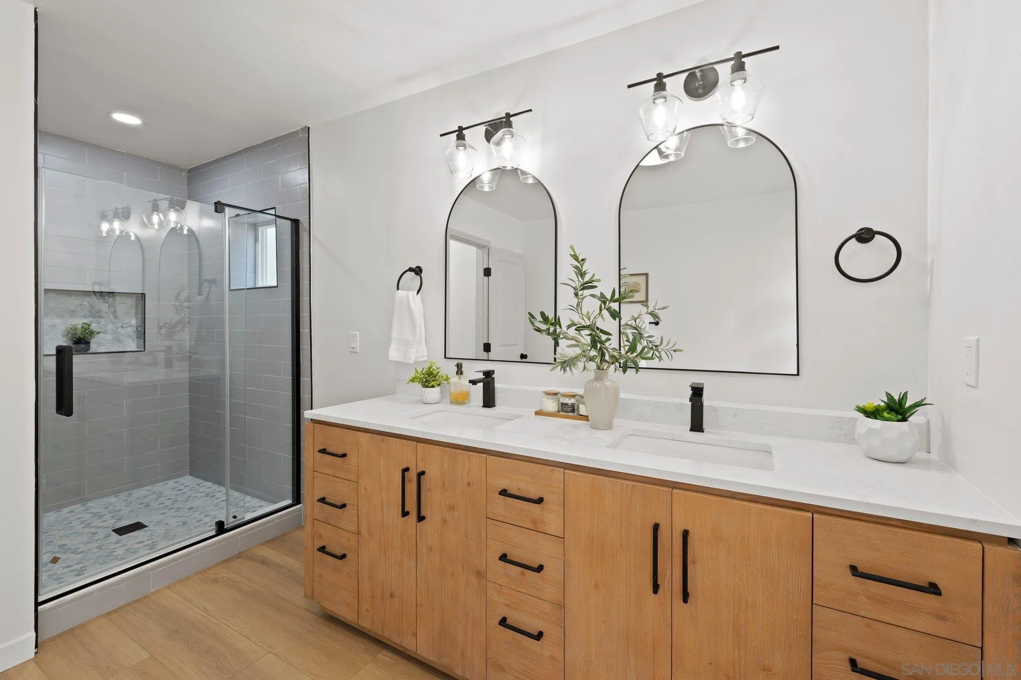 9117 Heatherdale Street Santee, CA 92071 - Photo 17 of 31 a bathroom with double sink and a mirror