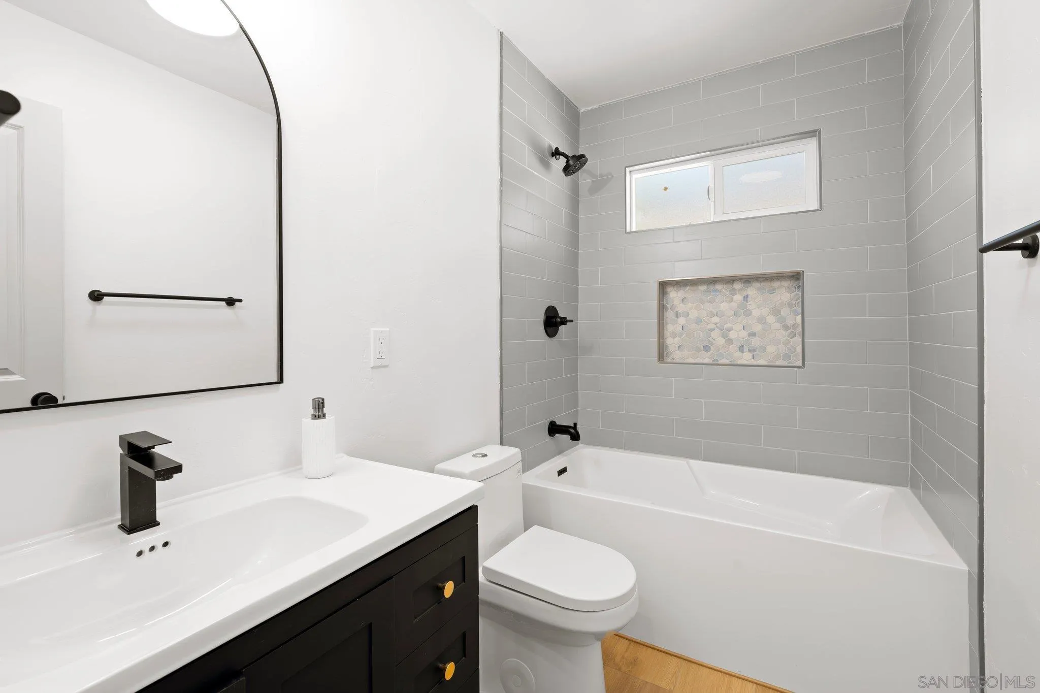 9117 Heatherdale Street Santee, CA 92071 - Photo 20 of 31 a bathroom with a sink a toilet and shower