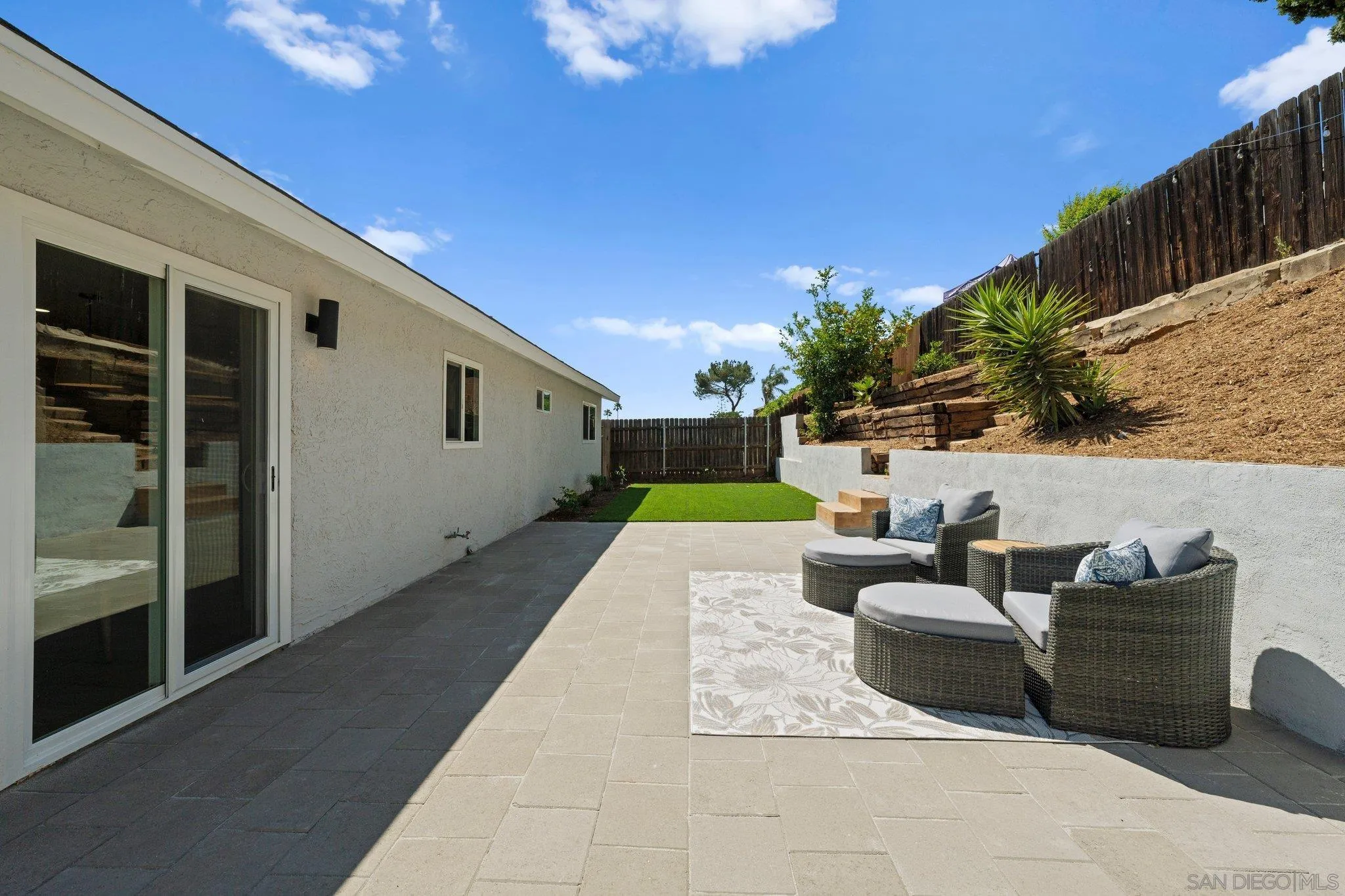 9117 Heatherdale Street Santee, CA 92071 - Photo 25 of 31 a view of backyard with outdoor seating and plants