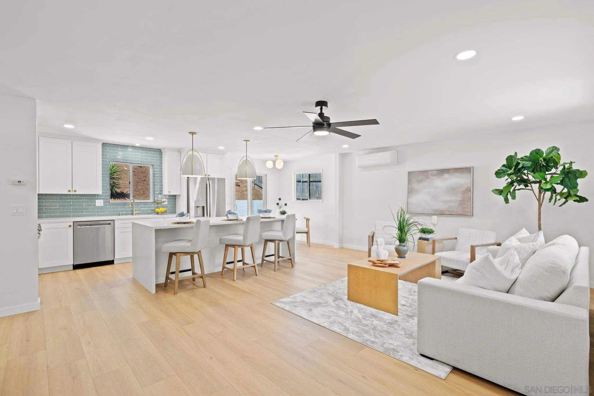 9117 Heatherdale Street Santee, CA 92071 - Photo 3 of 31 a living room with furniture and kitchen view