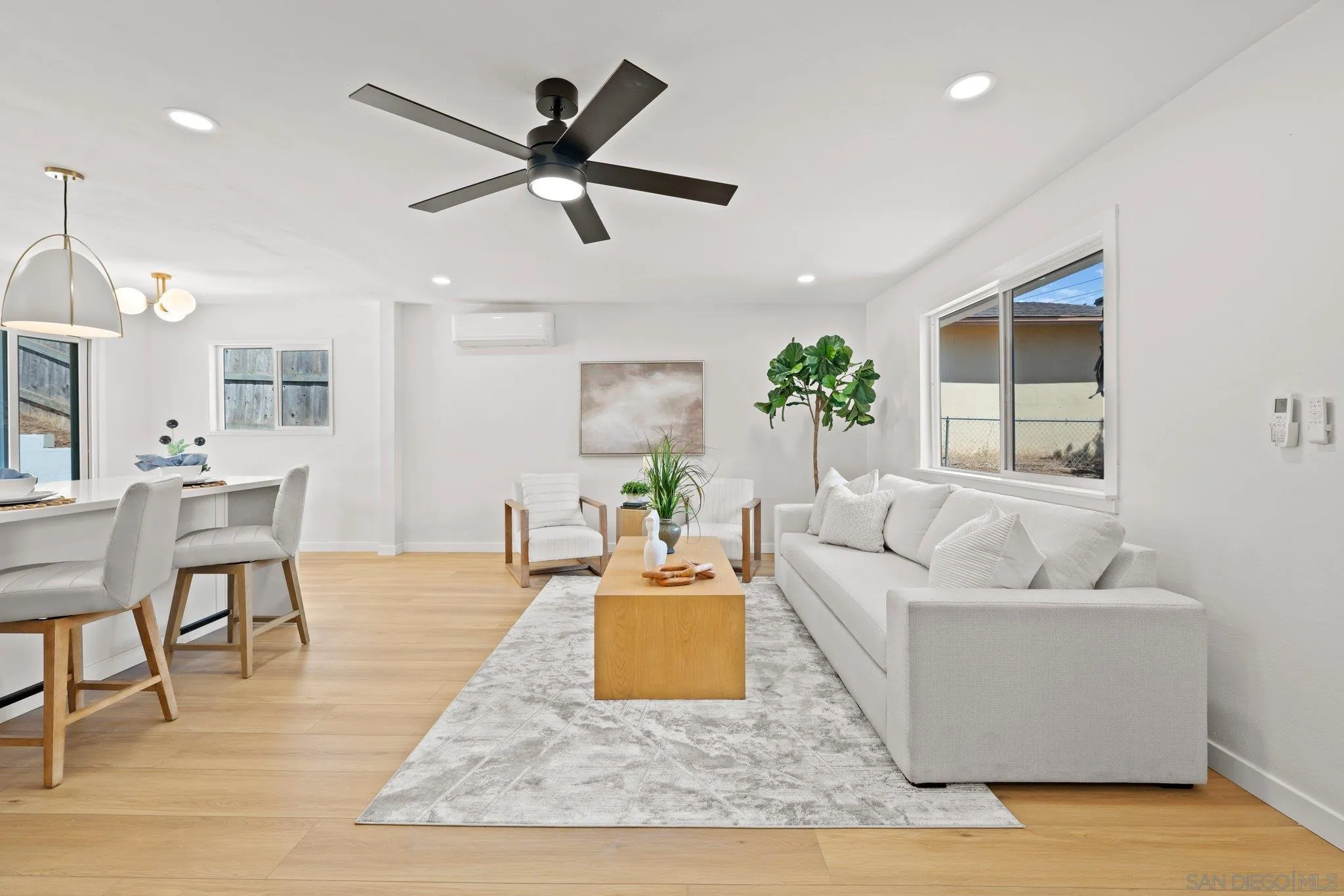 9117 Heatherdale Street Santee, CA 92071 - Photo 4 of 31 a living room with furniture and a wooden floor