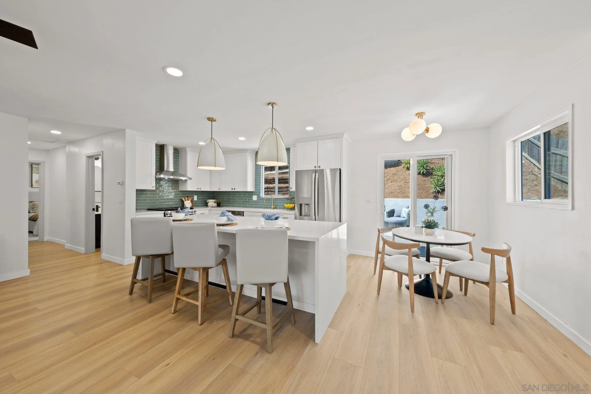 9117 Heatherdale Street Santee, CA 92071 - Photo 6 of 31 a view of a dining room with furniture and wooden floor