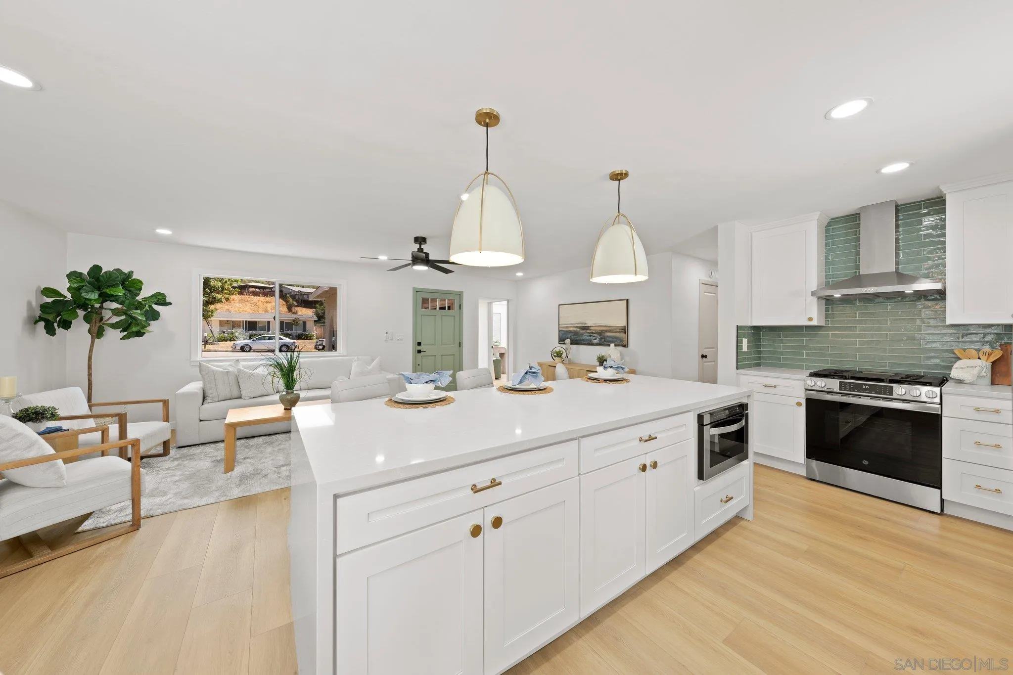 9117 Heatherdale Street Santee, CA 92071 - Photo 10 of 31 a kitchen with sink stove and cabinets