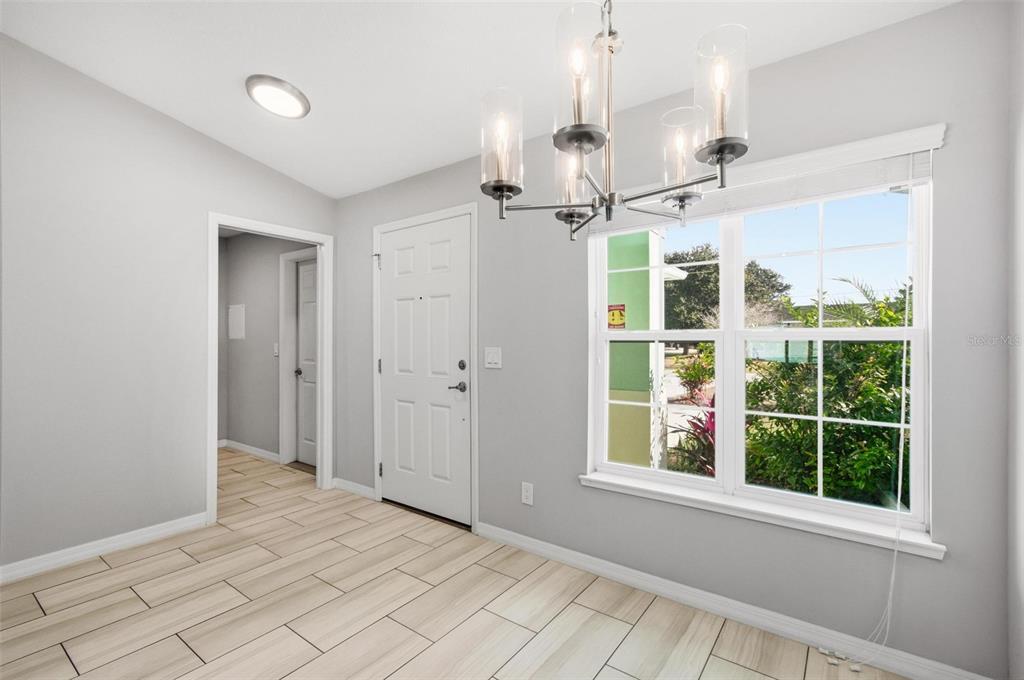 2 Lynton Place, Unit B Palm Coast, FL 32137 - Photo 11 of 51 a view of a room with a windows and ceiling fan