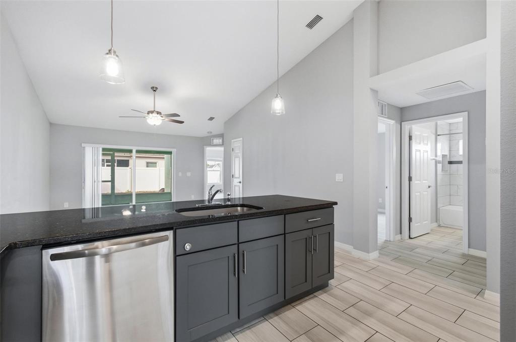 2 Lynton Place, Unit B Palm Coast, FL 32137 - Photo 19 of 51 a kitchen with a sink and refrigerator