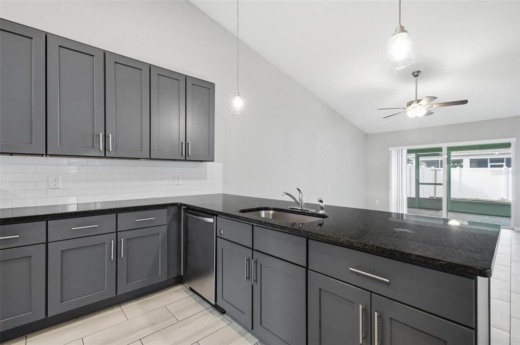 2 Lynton Place, Unit B Palm Coast, FL 32137 - Photo 20 of 51 a kitchen with a sink and cabinets