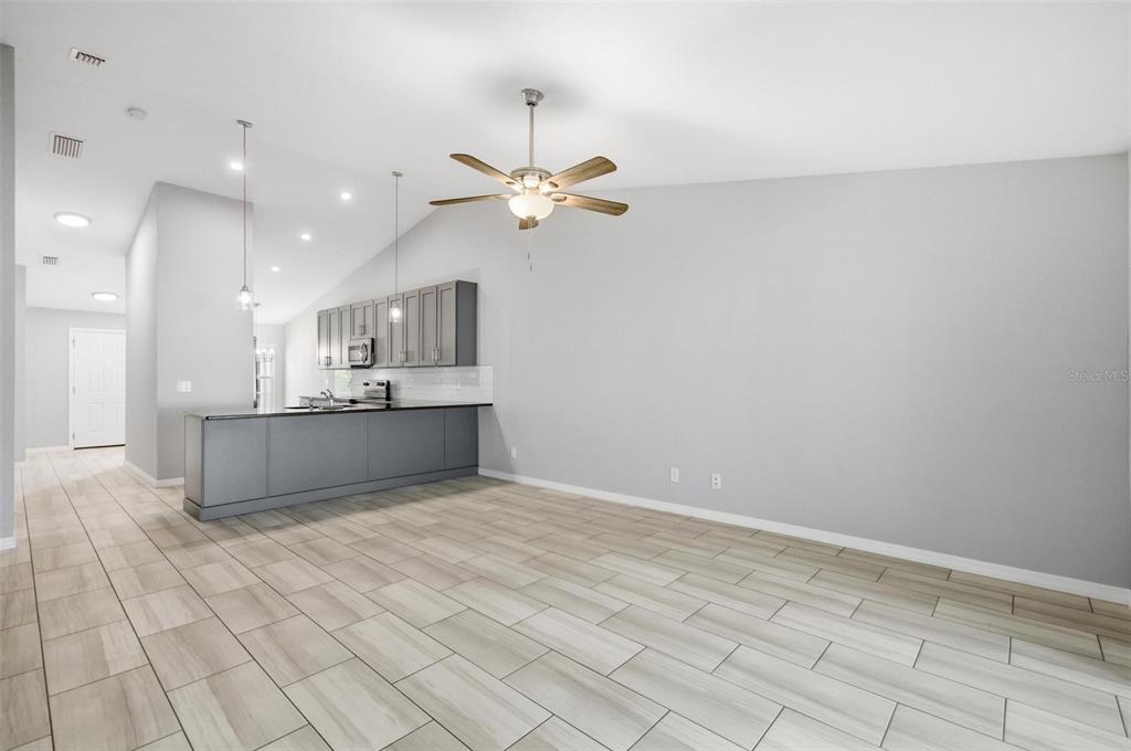 2 Lynton Place, Unit B Palm Coast, FL 32137 - Photo 26 of 51 a view of a kitchen with a sink and a chandelier fan