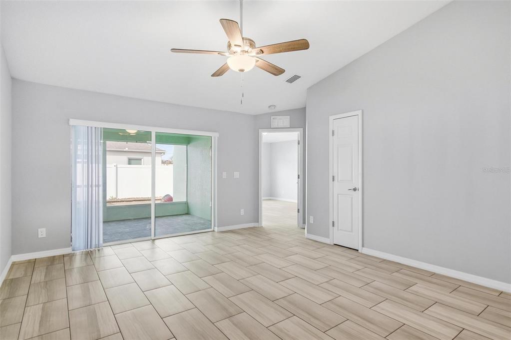 2 Lynton Place, Unit B Palm Coast, FL 32137 - Photo 28 of 51 wooden floor in an empty room with a ceiling fan
