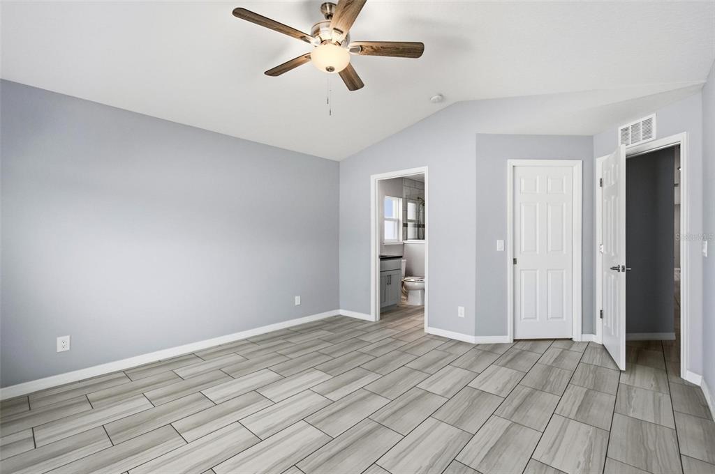 2 Lynton Place, Unit B Palm Coast, FL 32137 - Photo 30 of 51 wooden floor in an empty room with a window