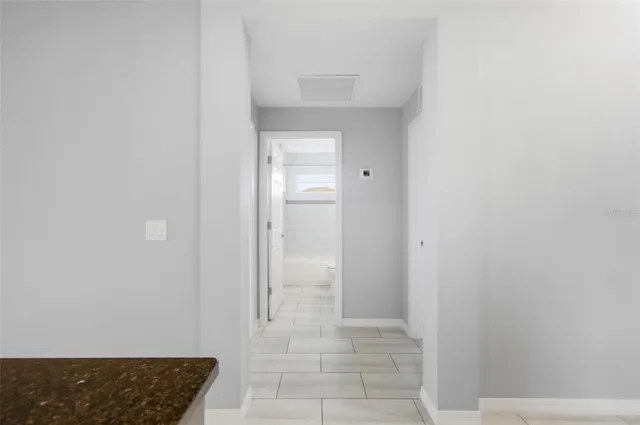 a view of a bathroom from the hallway