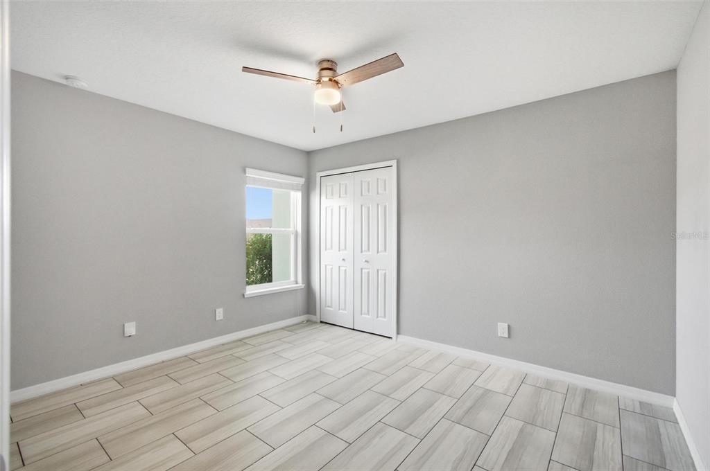 2 Lynton Place, Unit B Palm Coast, FL 32137 - Photo 42 of 51 wooden floor in an empty room with a window