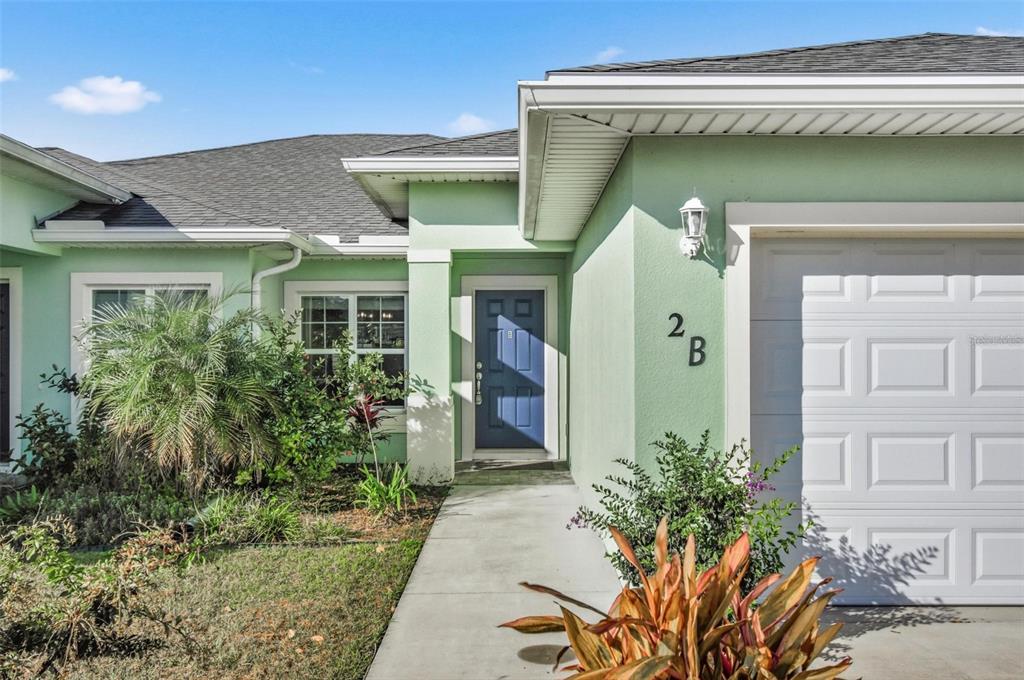 2 Lynton Place, Unit B Palm Coast, FL 32137 - Photo 6 of 51 a front view of a house with garden