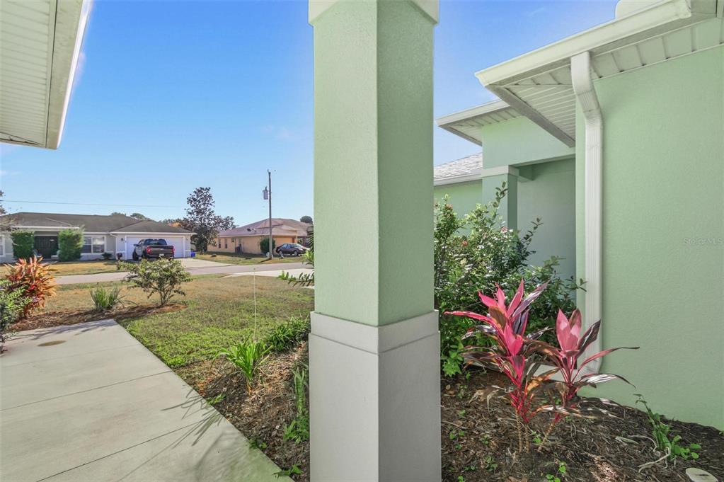 2 Lynton Place, Unit B Palm Coast, FL 32137 - Photo 7 of 51 a view of a house with a backyard and garden