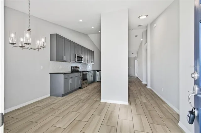 a view of a kitchen from the hallway