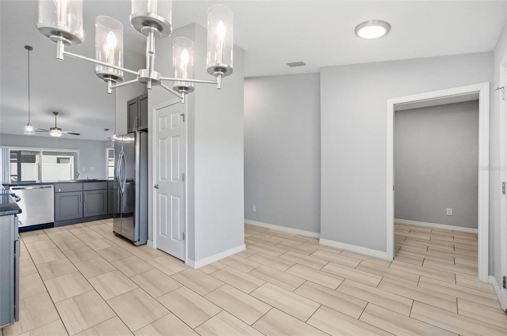 2 Lynton Place, Unit B Palm Coast, FL 32137 - Photo 10 of 51 a view of a kitchen with a sink and a refrigerator